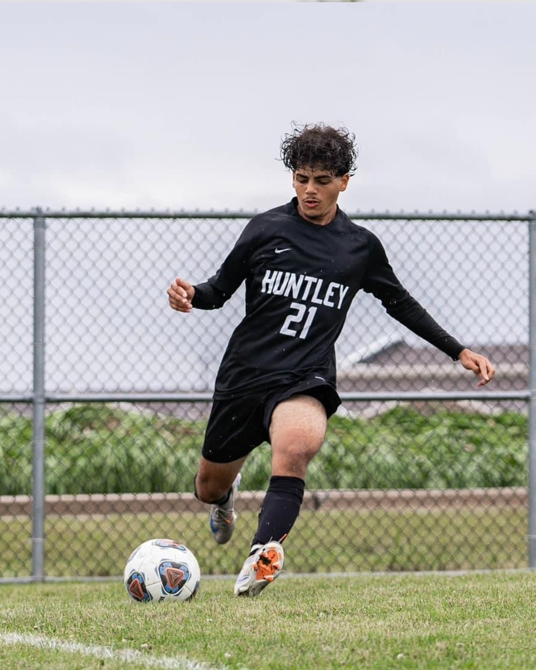 Kerellos Abdelmalak portrait playing soccer, natural light